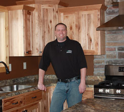 Owner Standing In Remodeled Kitchen